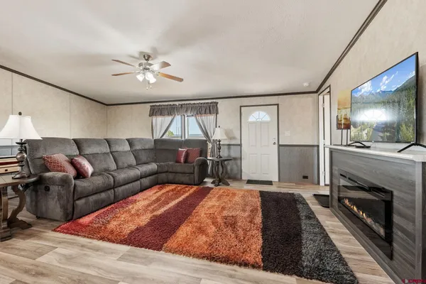 a living room with furniture and a fireplace