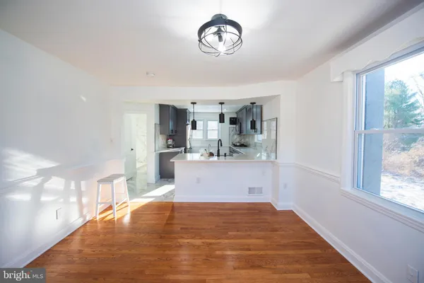 a view of kitchen and wooden floor