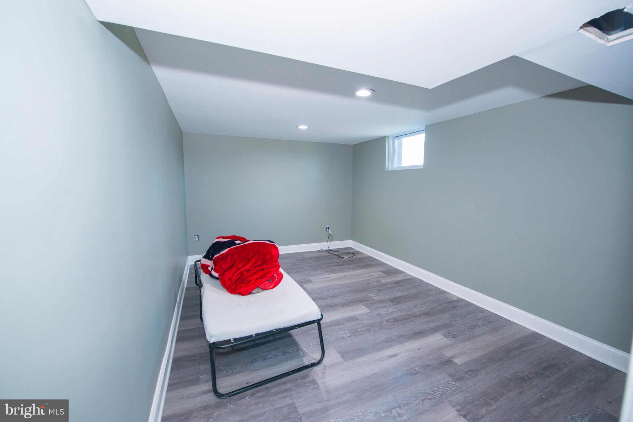 10909 Philadelphia Road White Marsh, MD 21162 - Photo 24 of 49 a room with a bed and a couch