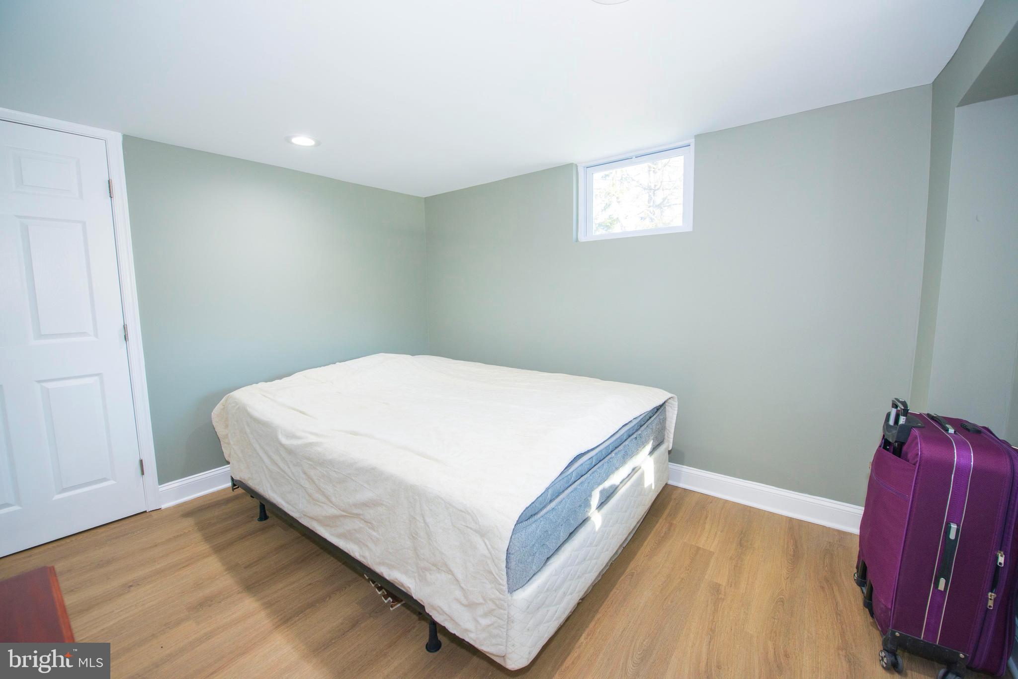 10909 Philadelphia Road White Marsh, MD 21162 - Photo 27 of 49 a bedroom with a bed and window