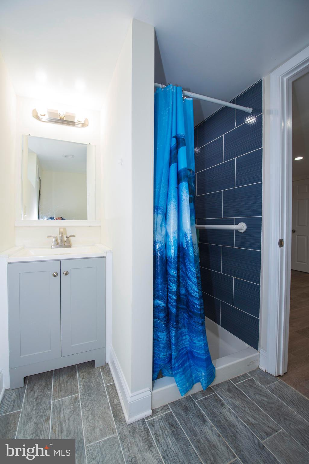 10909 Philadelphia Road White Marsh, MD 21162 - Photo 28 of 49 a bathroom with a sink and a mirror