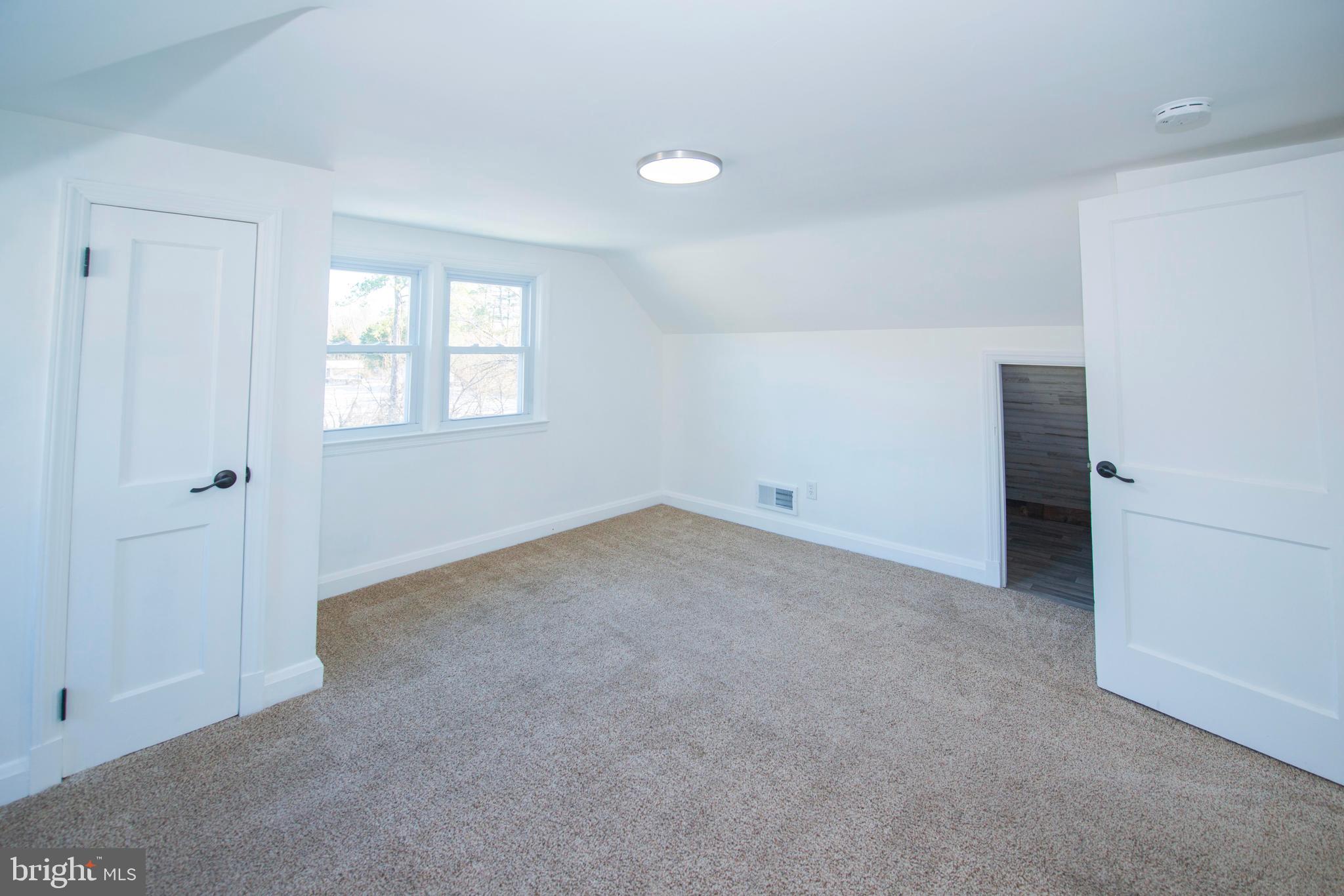 10909 Philadelphia Road White Marsh, MD 21162 - Photo 34 of 49 an empty room with windows and closet