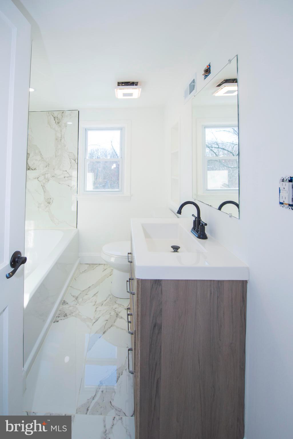 10909 Philadelphia Road White Marsh, MD 21162 - Photo 35 of 49 a bathroom with a sink and a mirror