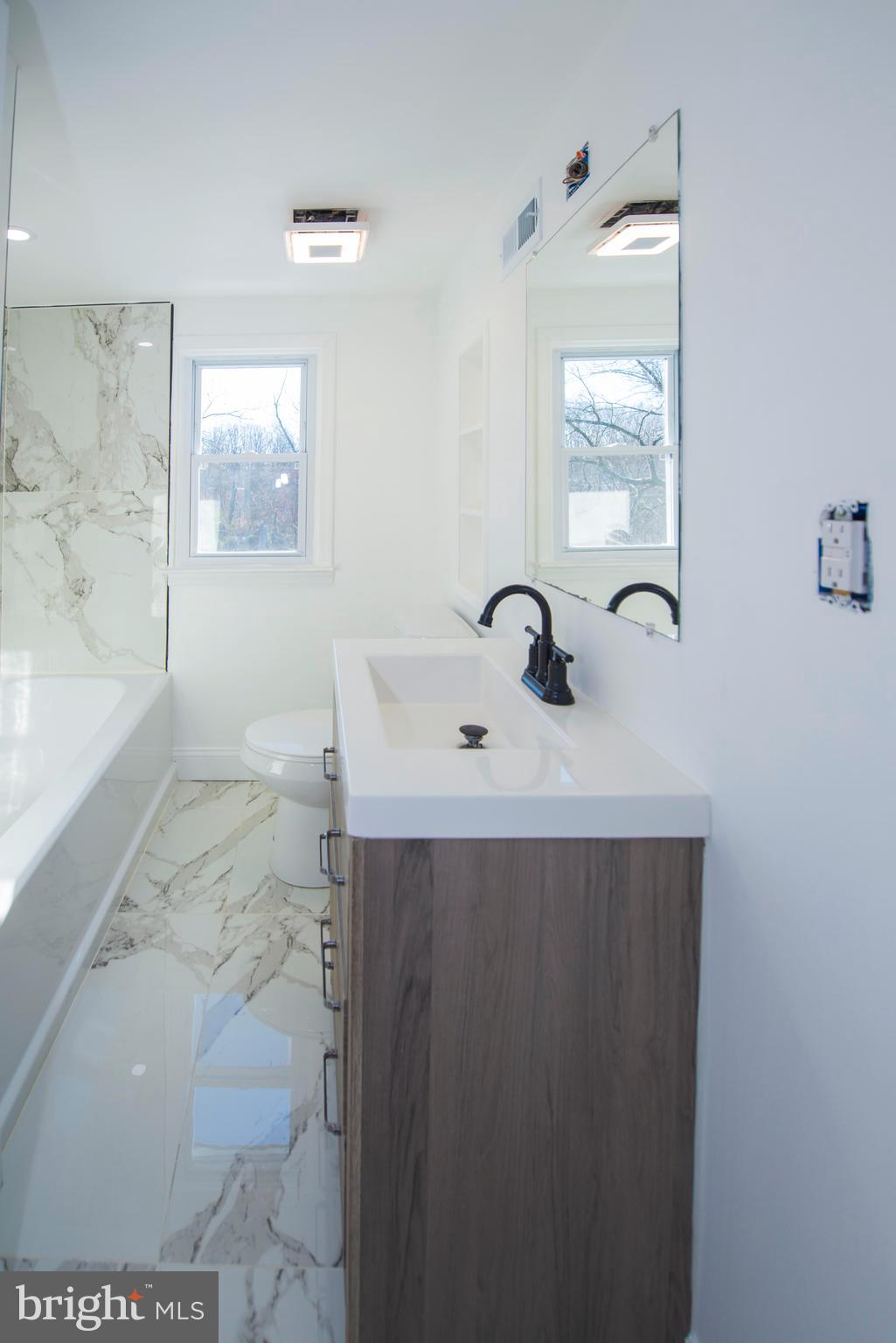 10909 Philadelphia Road White Marsh, MD 21162 - Photo 38 of 49 a bathroom with a sink and a mirror