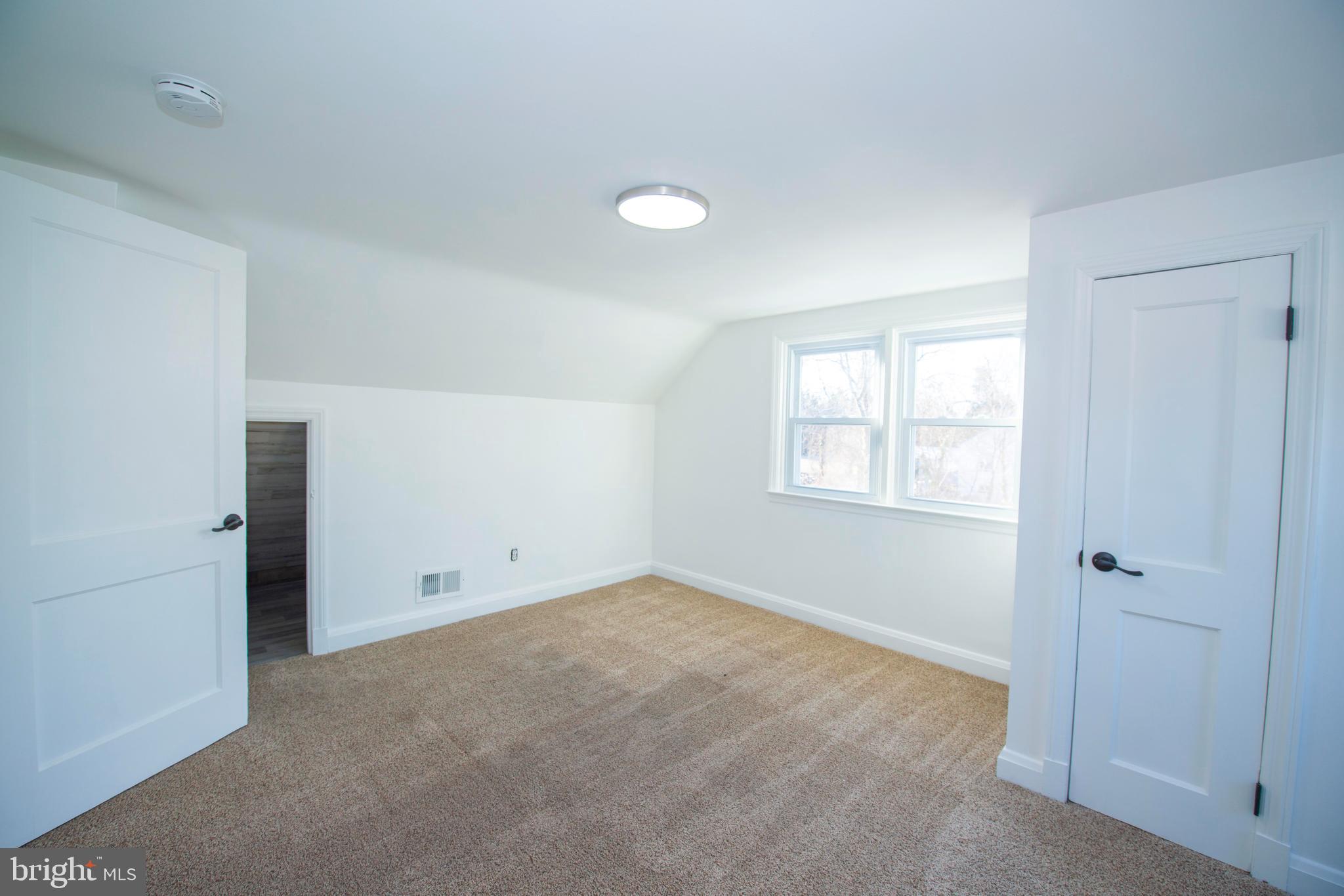 10909 Philadelphia Road White Marsh, MD 21162 - Photo 42 of 49 an empty room with windows and closet
