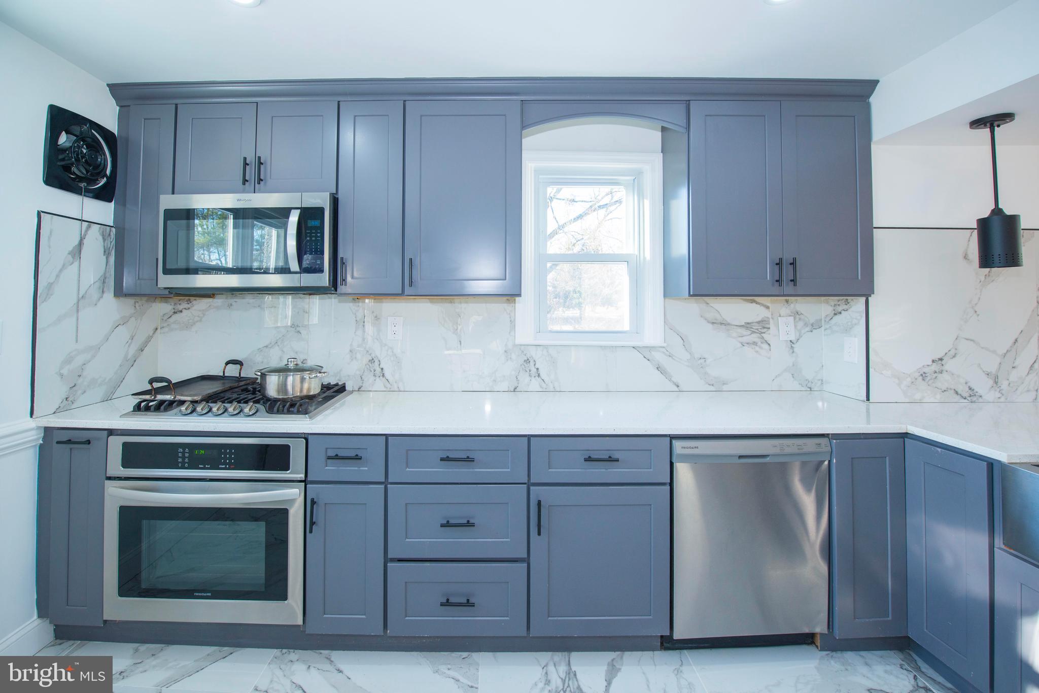 10909 Philadelphia Road White Marsh, MD 21162 - Photo 8 of 49 a kitchen with cabinets appliances and a sink