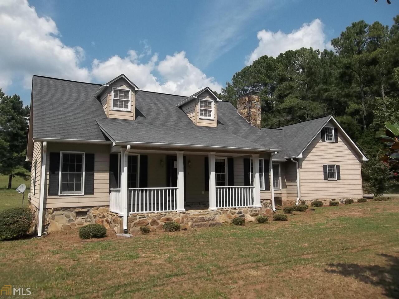 1378 Macedonia Road Newnan, GA 30263 - Photo 1 of 1 a front view of a house with a yard