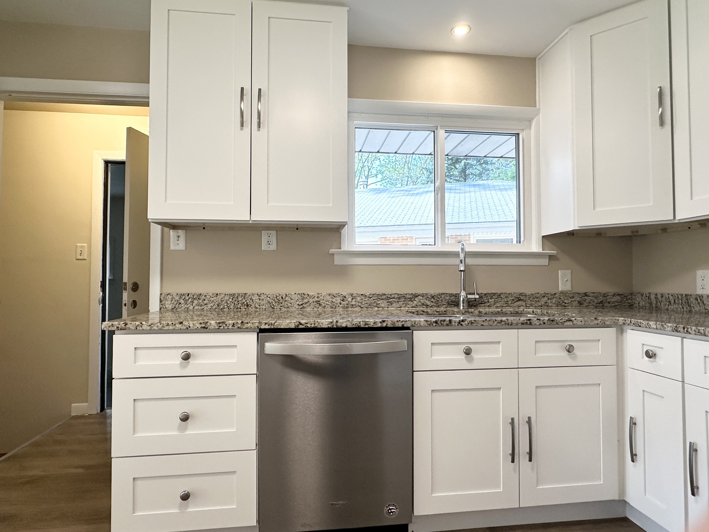 460 South Wall Street Kankakee, IL 60901 - Photo 11 of 52 a kitchen with granite countertop white cabinets and window