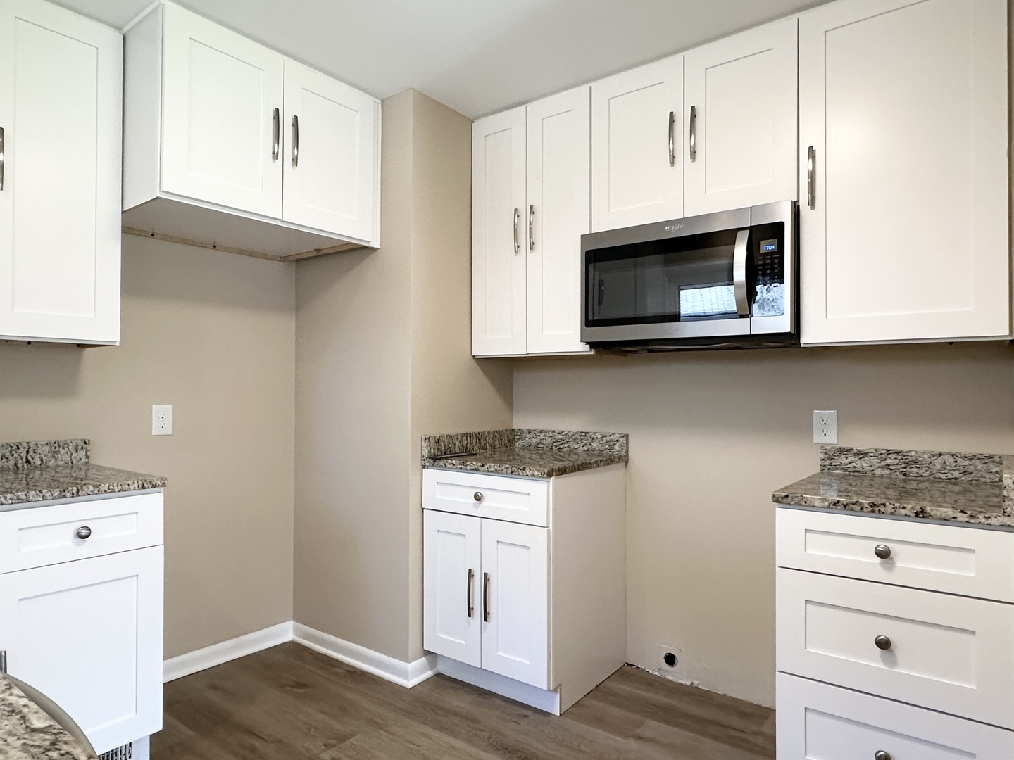 460 South Wall Street Kankakee, IL 60901 - Photo 13 of 52 a kitchen with stainless steel appliances white cabinets and a stove top oven