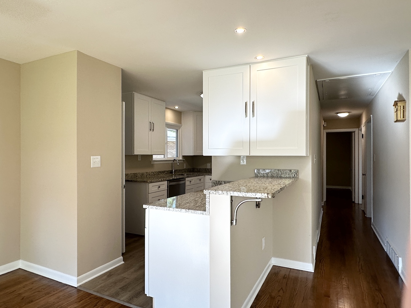 460 South Wall Street Kankakee, IL 60901 - Photo 15 of 52 a kitchen with a sink a refrigerator and wooden floor