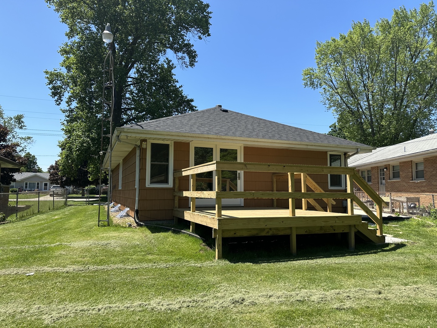 460 South Wall Street Kankakee, IL 60901 - Photo 40 of 52 a view of a house with a yard deck and a large tree