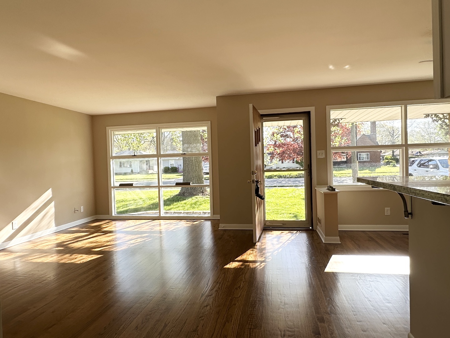460 South Wall Street Kankakee, IL 60901 - Photo 9 of 52 a view of an empty room with wooden floor and a window