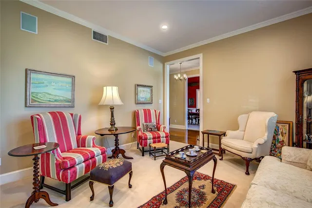 a living room with furniture and a lamp