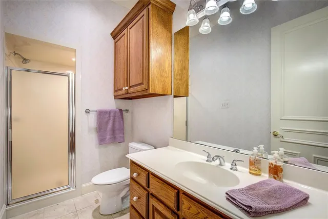 a large bathroom with a glass shower door