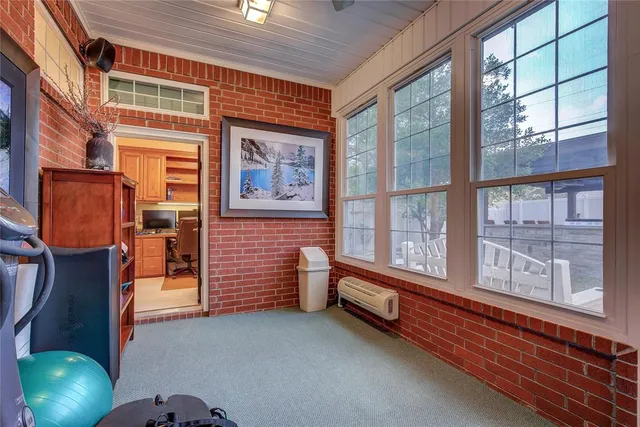 a bathroom with a granite countertop sink a toilet and a mirror