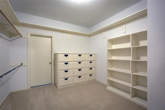 a room with furniture pool table and a window