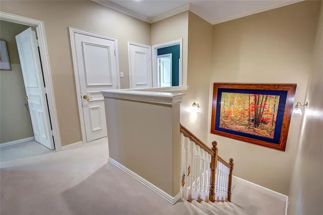 a bedroom with a bed cabinets and a window