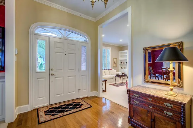 a view of room with wooden floor and cabinet