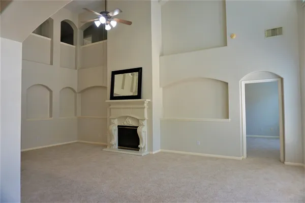 a view of empty room with fireplace