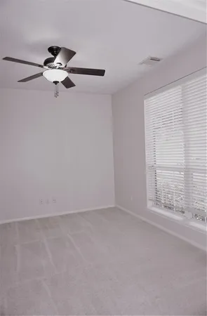 a view of empty room with windows