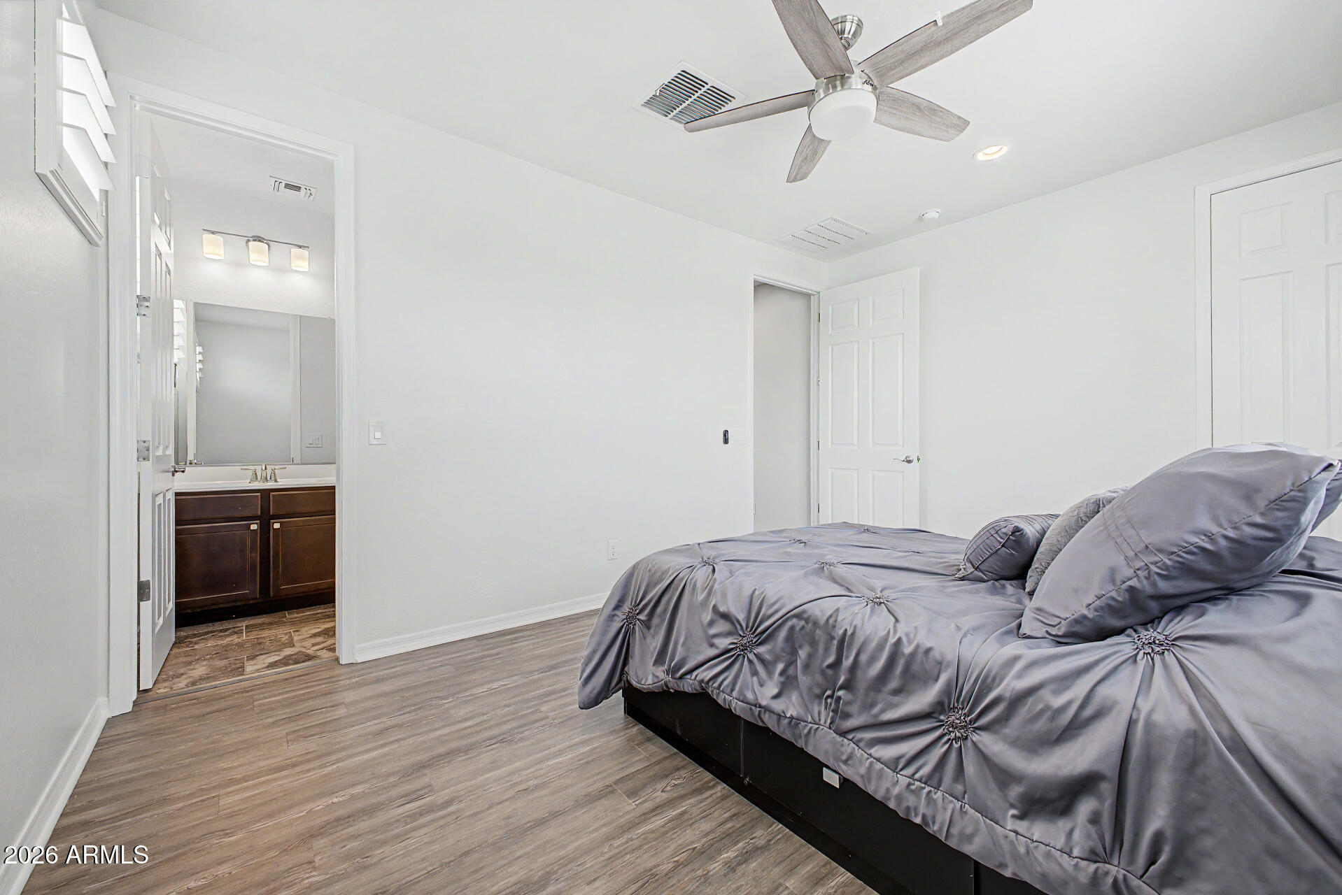 1076 East Kensington Road Gilbert, AZ 85297 - Photo 19 of 73 a bedroom with a bed and a ceiling fan