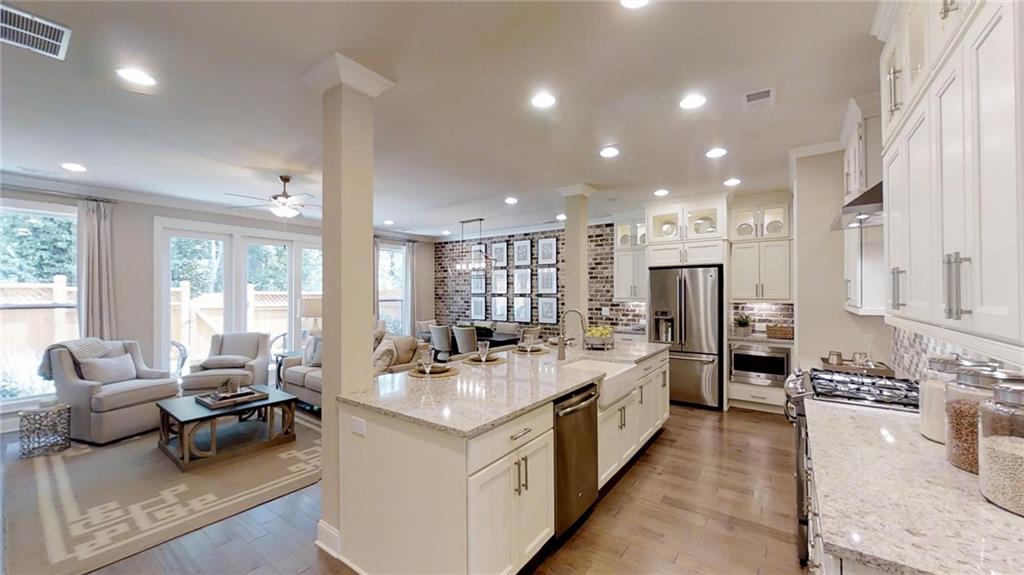 Welcome home to Atley in Downtown Alpharetta! PHOTOS SHOWN ARE OF FINISHED HOME AND FOR VIEWING PURPOSE TO UNDERSTAND LAYOUT ONLY