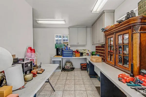 a view of a house with backyard and a tree