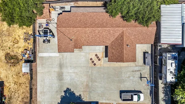 a living room with furniture a flat screen tv and a window