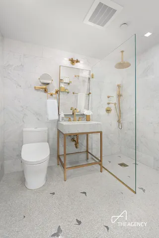 a bedroom with a bed and a view of bathroom