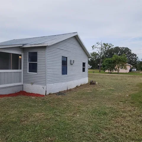 a view of a backyard of the house