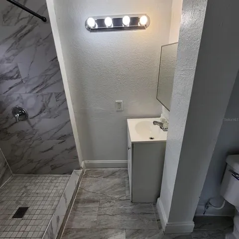 a bathroom with a sink and mirror