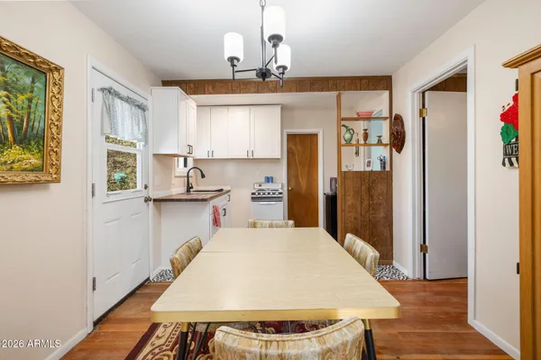 a very nice looking dining room with a table and chairs