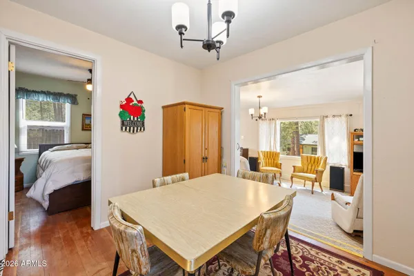 a living room with furniture and a lamp