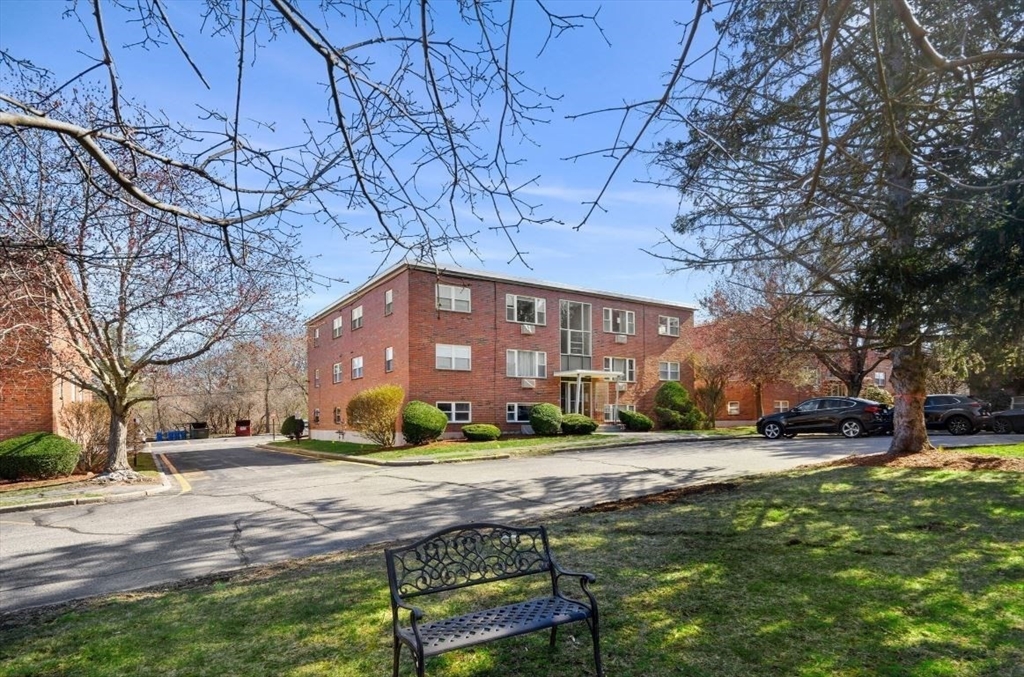 a view of a building with a yard