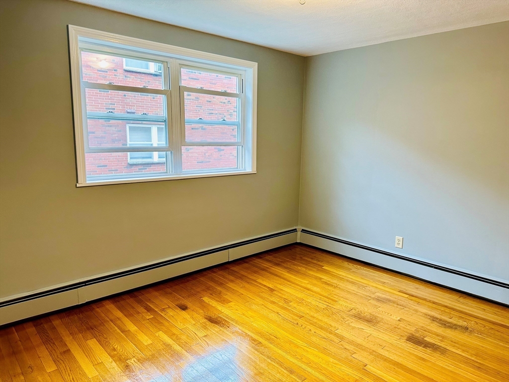 1105 Lexington Street, Unit 84 Waltham, MA 02452 - Photo 3 of 5 a view of a room with a large window