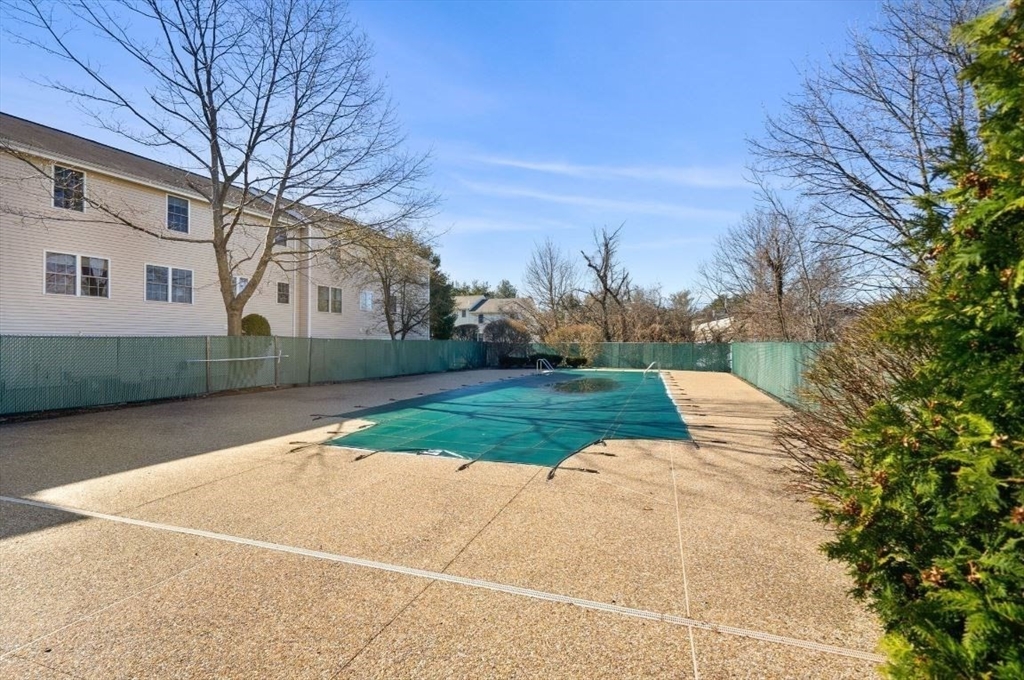 1105 Lexington Street, Unit 84 Waltham, MA 02452 - Photo 5 of 5 a view of backyard of the house