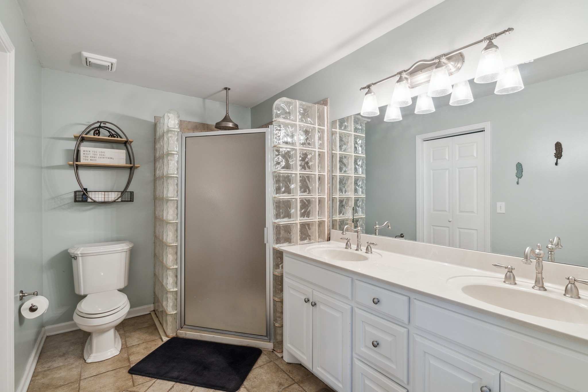 4520 Mt Sharon Road Greenbrier, TN 37073 - Photo 19 of 42 a bathroom with a double vanity sink mirror and toilet