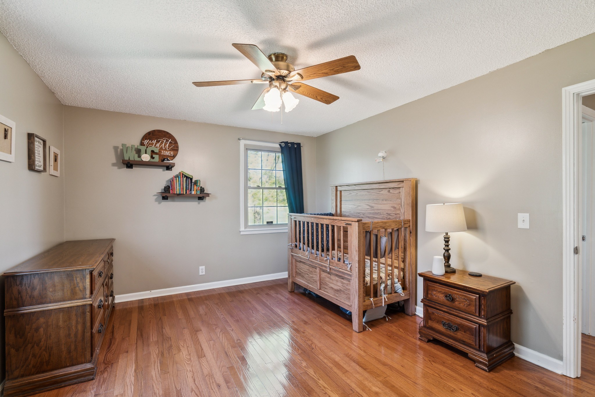 4520 Mt Sharon Road Greenbrier, TN 37073 - Photo 20 of 42 a bedroom with a bed and a chandelier