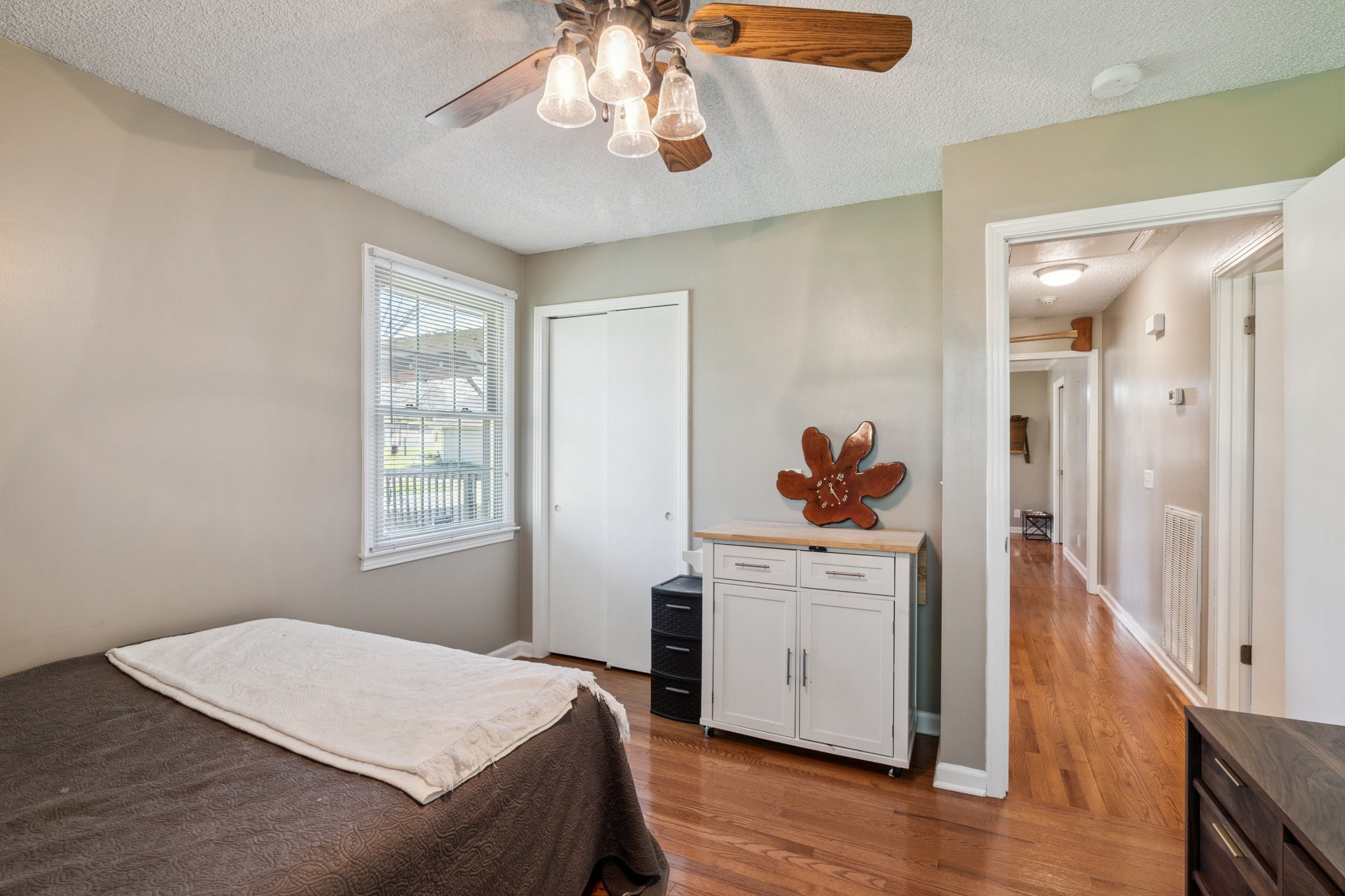 4520 Mt Sharon Road Greenbrier, TN 37073 - Photo 24 of 42 a bedroom with a bed and a chandelier