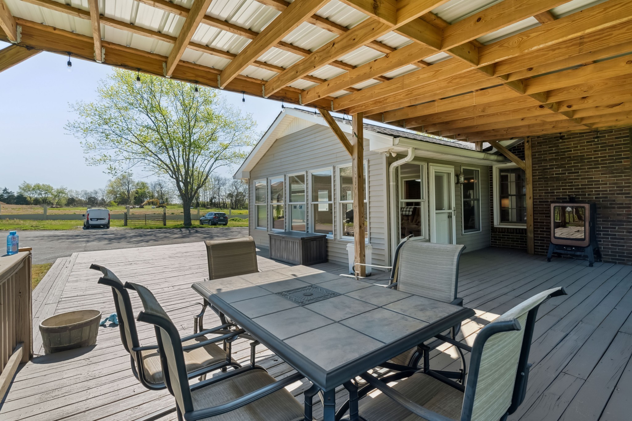 4520 Mt Sharon Road Greenbrier, TN 37073 - Photo 27 of 42 a view of a patio with table and chairs and potted plants