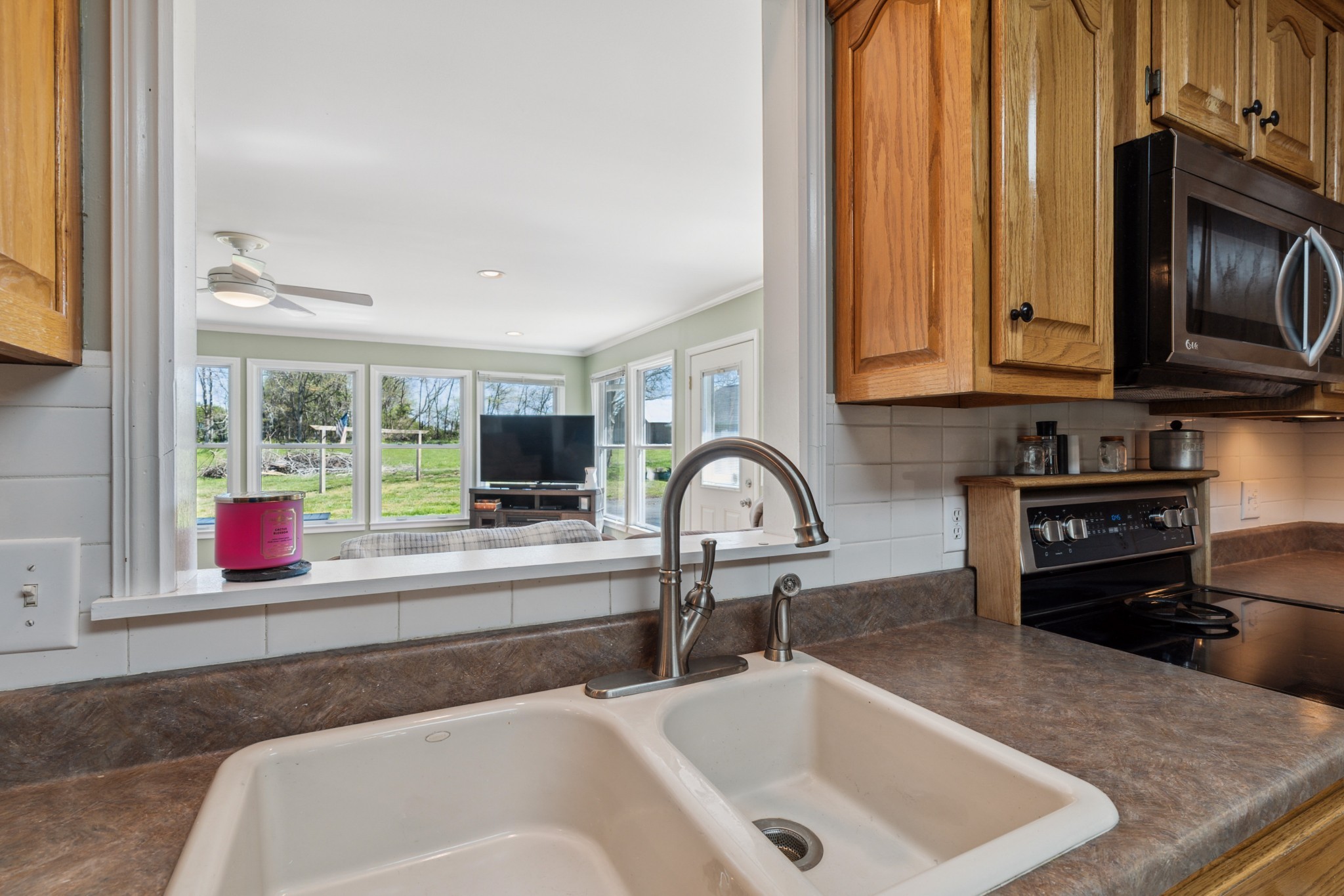 4520 Mt Sharon Road Greenbrier, TN 37073 - Photo 10 of 42 a kitchen with granite countertop a sink and a stove top oven