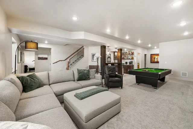 a living room with furniture and a table