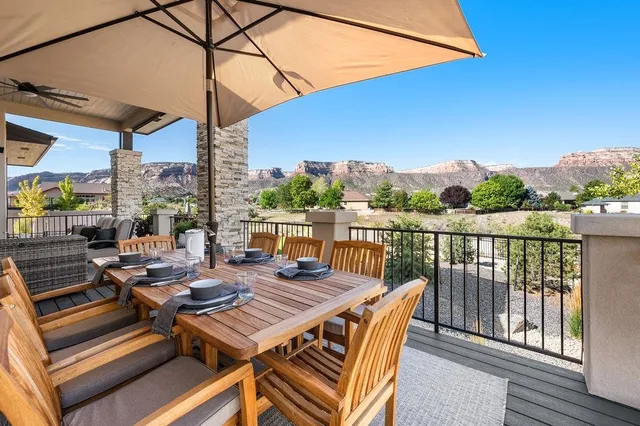 an outdoor space with furniture and umbrella