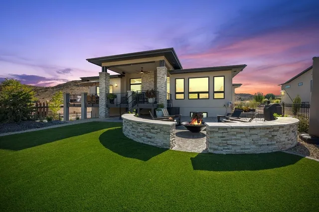 a view of a house with pool and chairs