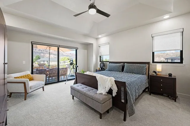 a spacious bedroom with a bed and a couch