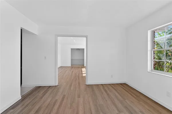 a kitchen with stainless steel appliances granite countertop a refrigerator a stove and a sink