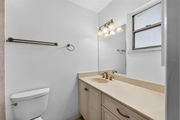 a utility room with cabinets dryer and washer