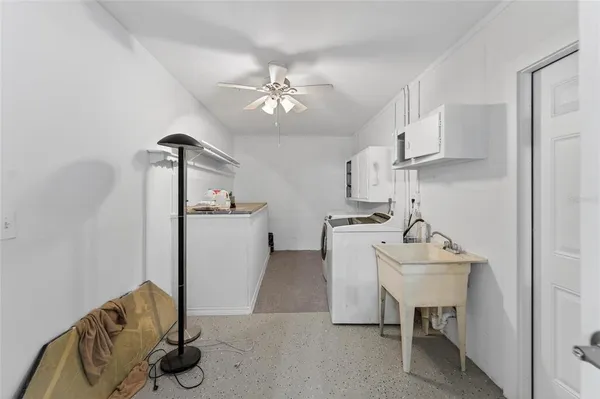 a view of a swimming pool with an outdoor space and seating area