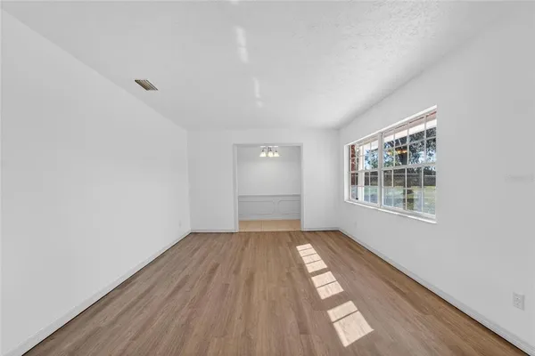 a view of wooden floor in an empty room