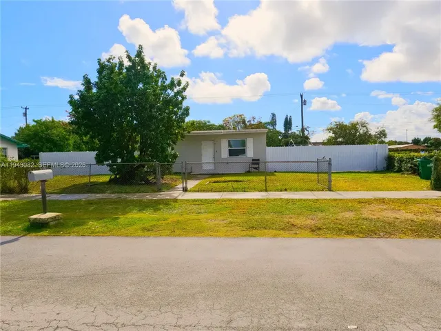 a view of a swimming pool with an outdoor space and seating area